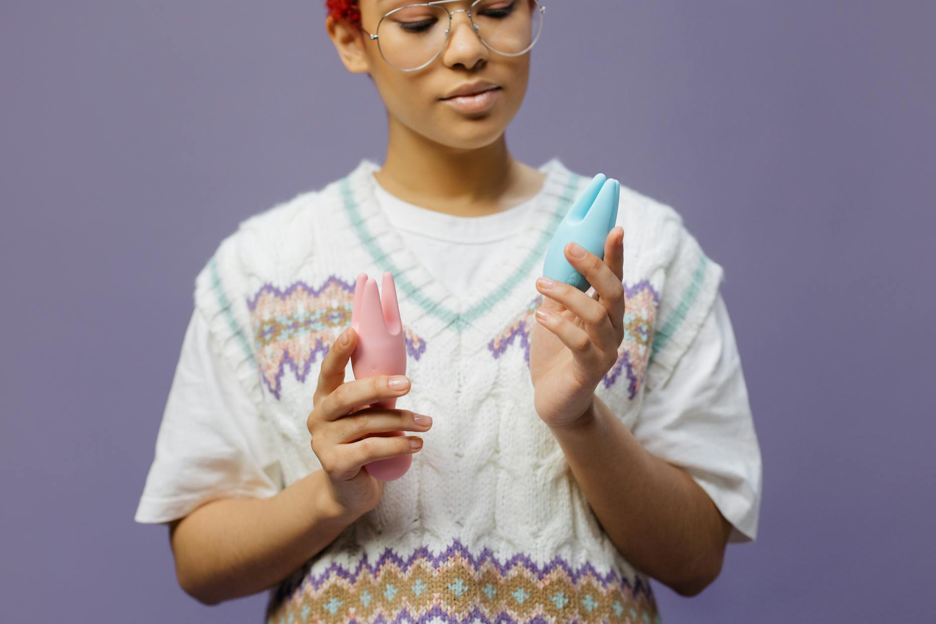 Woman considering her options for pain-free pleasure with clitoral vibrators