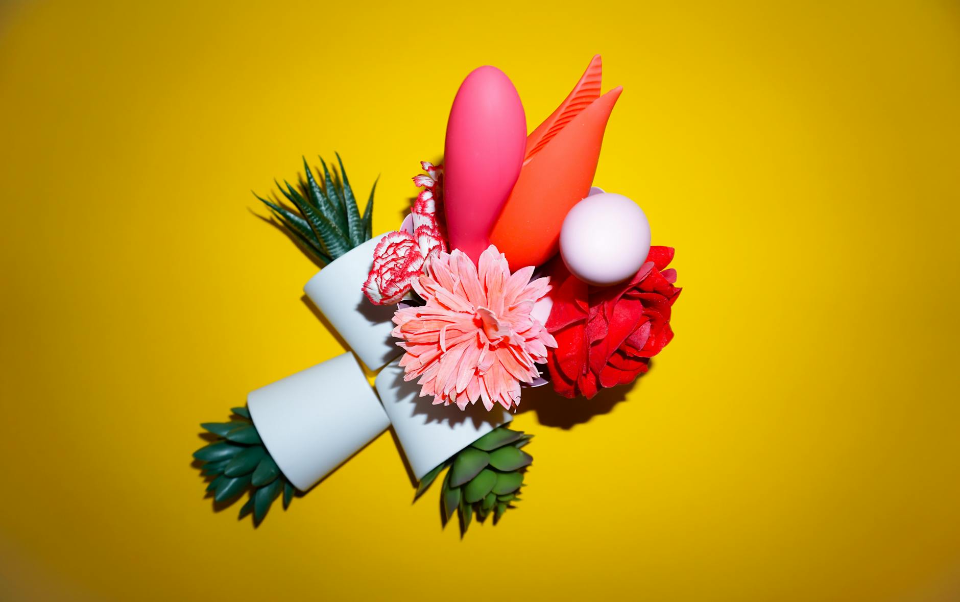 Array of vibrant adult toys showing diverse shapes and colors for pleasure exploration